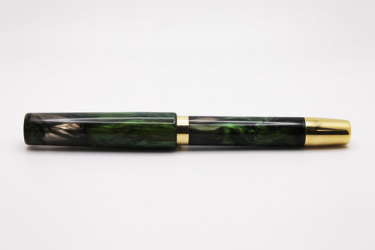 Ferryman Piston Filler in Green, Black, and Brass