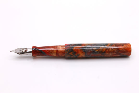 Little Miss in Orange, Red, and Grey Resin
